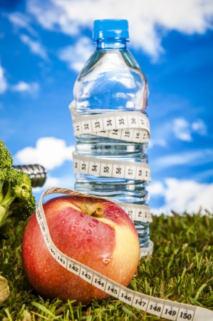 Fitness stuff with light background and friutsの写真素材