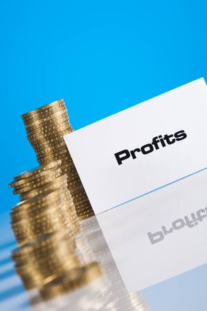 Financial and bussines with bussines stuff and gold coinsの写真素材