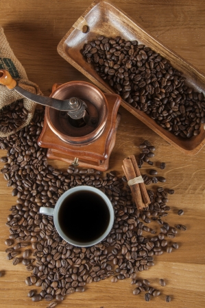 Coffee beans, wooden table with ambient lightの写真素材