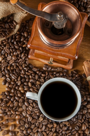 Coffee beans, wooden table with ambient lightの写真素材
