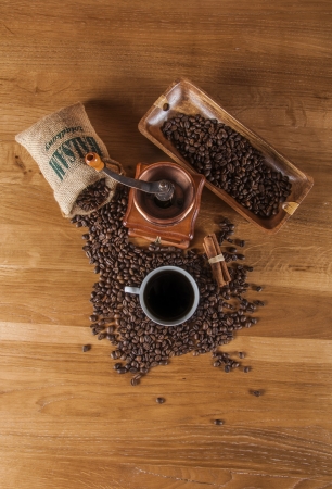 Coffee beans, wooden table with ambient lightの写真素材
