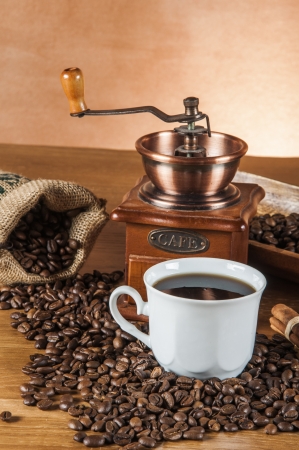 Coffee beans, wooden table with ambient lightの写真素材