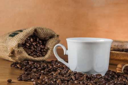 Coffee beans, wooden table with ambient lightの写真素材