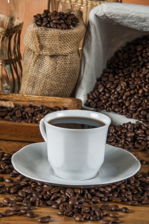 Coffee theme with wooden table and dark backgroundの写真素材