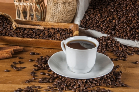 Coffee theme with wooden table and dark backgroundの写真素材