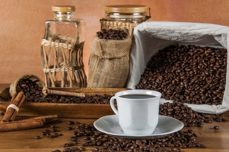 Coffee theme with wooden table and dark backgroundの写真素材