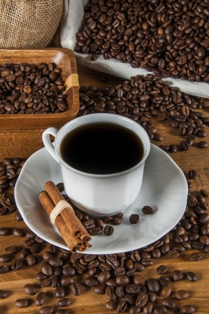 Coffee theme with wooden table and dark backgroundの写真素材