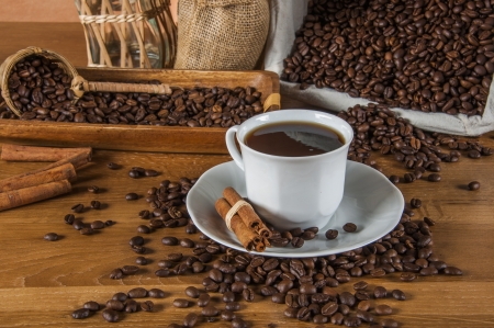 Coffee theme with wooden table and dark backgroundの写真素材
