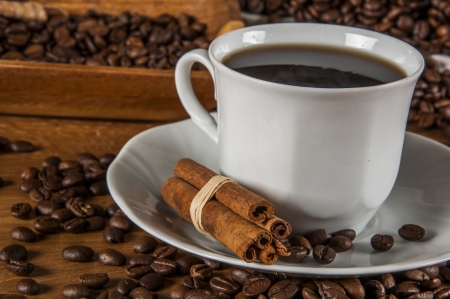 Coffee theme with wooden table and dark backgroundの写真素材
