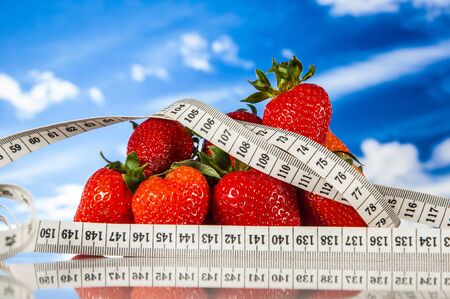 Ftness theme with fruts, vegetables, bright blue backgroundの写真素材