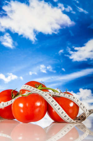 Fitness theme with fruits and blue sky backgroundの写真素材