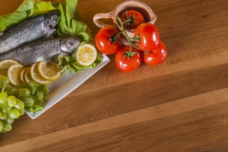 Trout on the plate with vegetablesの写真素材