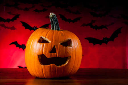 Dark composition of halloween pumpkinsの写真素材