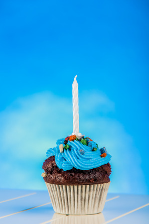 Home baked and tasty sweets on the blue backgroundの写真素材