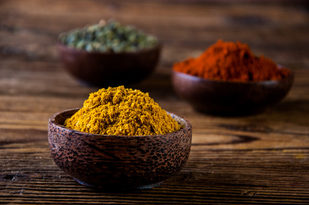 Traditional Asian concept with spices in wooden bowlsの写真素材