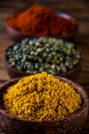 Traditional Asian concept with spices in wooden bowlsの写真素材