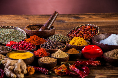 Spices in wooden Indonesian bowlsの写真素材