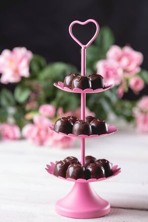Tasty valentines sweets with rosesの写真素材