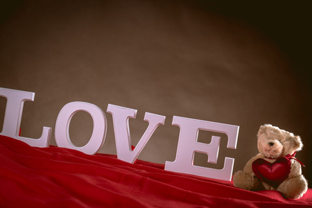 Valentine concept on wooden table with white lettersの写真素材