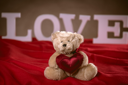 Valentine concept on wooden table with white lettersの写真素材