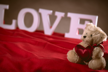 Valentine concept on wooden table with white lettersの写真素材