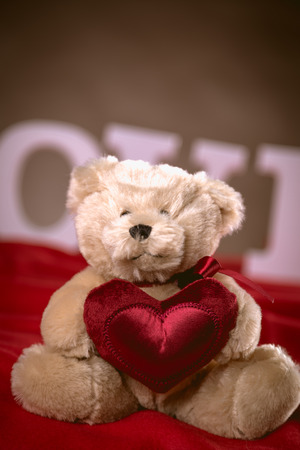 Valentine concept on wooden table with white lettersの写真素材