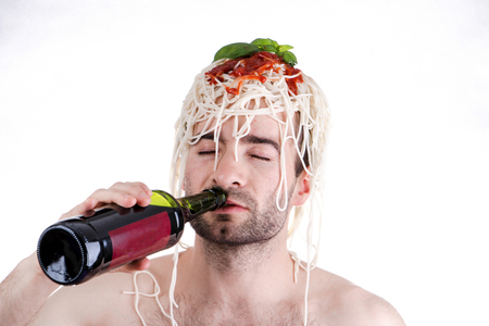 Funny man with spaghetti on head, white backgroundの写真素材