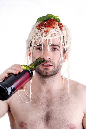 Funny man with spaghetti on head, white backgroundの写真素材