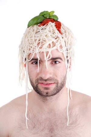 Funny man with spaghetti on head, white backgroundの写真素材