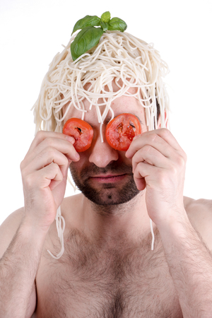 Funny man with spaghetti on head, white backgroundの写真素材