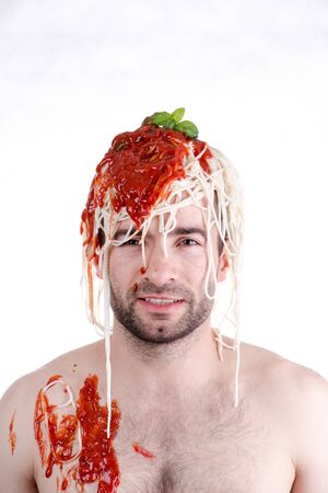 Funny man with spaghetti on head, white backgroundの写真素材