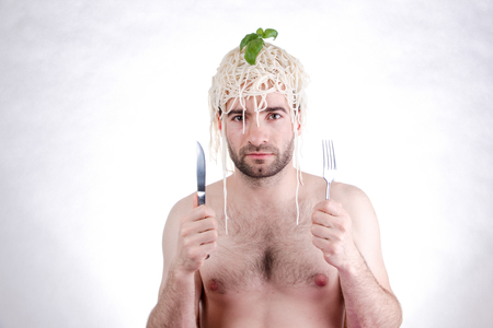 Funny man with spaghetti on head, white backgroundの写真素材