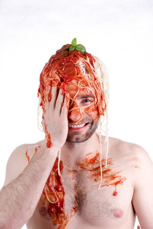 Funny man with spaghetti on head, white backgroundの写真素材