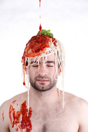 Funny man with spaghetti on head, white backgroundの写真素材