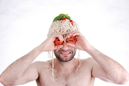 Funny man with spaghetti on head, white backgroundの写真素材
