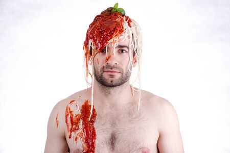 Funny man with spaghetti on head, white backgroundの写真素材