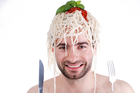 Funny man with spaghetti on head, white backgroundの写真素材