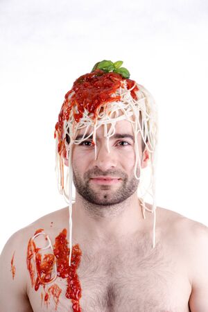 Funny man with spaghetti on head, white backgroundの写真素材