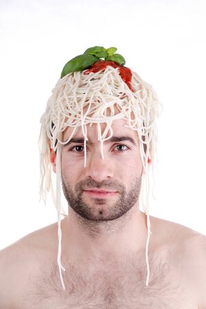 Funny man with spaghetti on head, white backgroundの写真素材