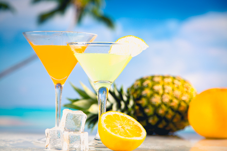 Colorful summer background with drink and palmsの写真素材