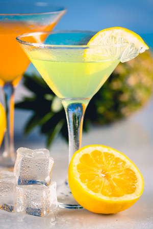 Colorful summer background with drink and palmsの写真素材