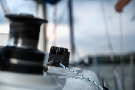Sailing equipment on white sail boatの写真素材