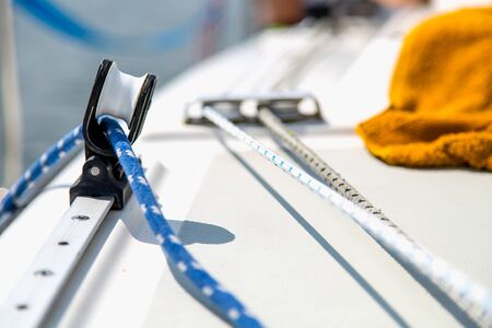 Sailing equipment on white sail boatの写真素材