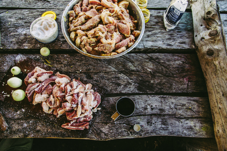 Raw meat on old wooden table, gray vintage decks backgroundの写真素材