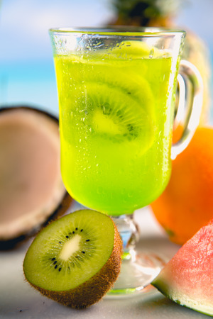 Set of exotic drinks on the beach with blue ocean backgroundの写真素材