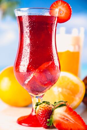 Set of exotic drinks on the beach with blue ocean backgroundの写真素材