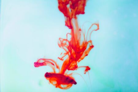 Red ink in water, artistic shot, abstract background