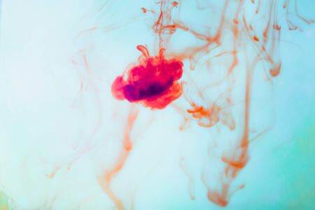 Red ink in water, artistic shot, abstract backgroundの写真素材