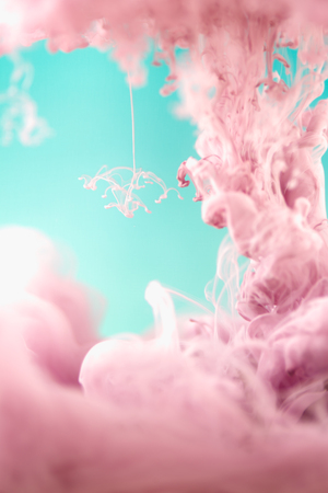 Pink ink in water, artistic shot, abstract backgroundの写真素材