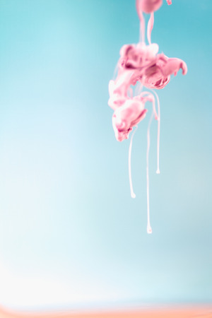 Pink ink in water, artistic shot, abstract backgroundの写真素材